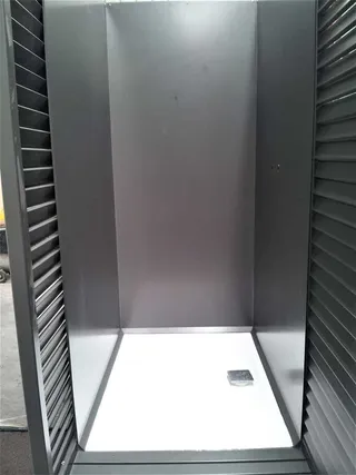 Interior of a tall louvred metal enclosure