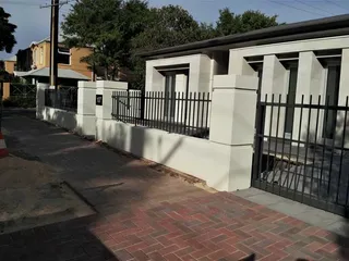 Black metal front fence along a residential property
