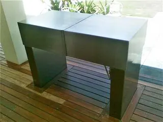 Rear view of a black metal outdoor barbecue cabinet