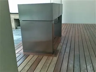 Side view of a fabricated outdoor barbecue cabinet