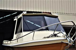 Cabin boat with fabricated stainless steel bow railing