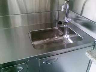 Stainless steel sink and benchtop with matching splashback