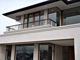 Horizontal stainless steel balcony balustrade on a modern home