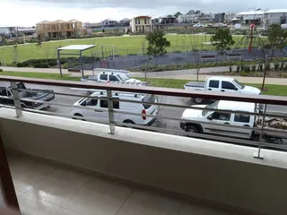 Stainless steel balcony balustrade overlooking a residential street