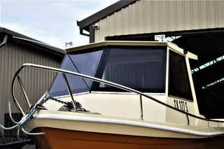 Stainless steel bow rail fitted to a cabin boat