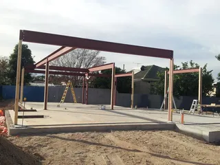 Structural steel frame erected on a residential concrete slab