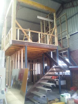 Steel staircase and mezzanine structure during construction