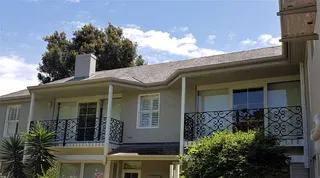 Decorative wrought iron balcony balustrades on a two-storey home
