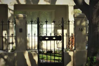 Wrought iron pedestrian gate and matching front fence